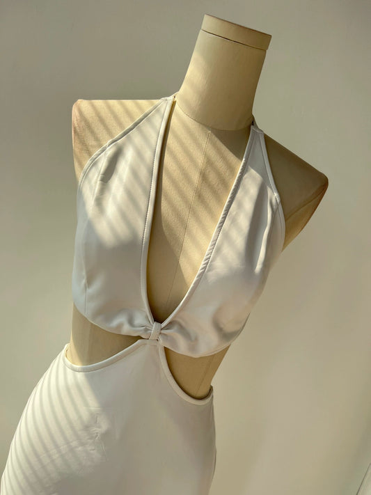 White Halter Neck Dress with Side Cut-Outs and a Low Neck Line