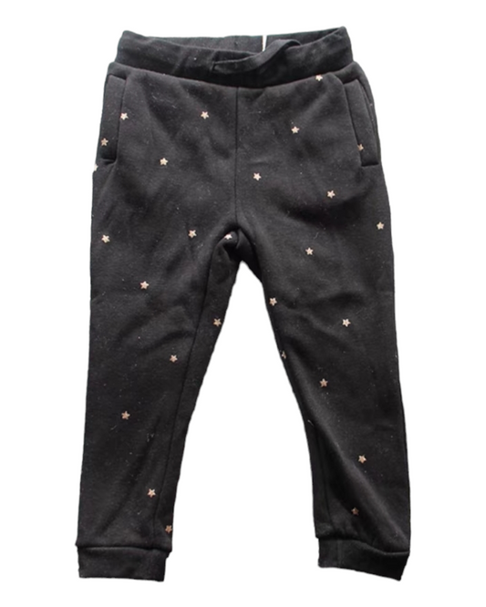 Black track pants with white spots